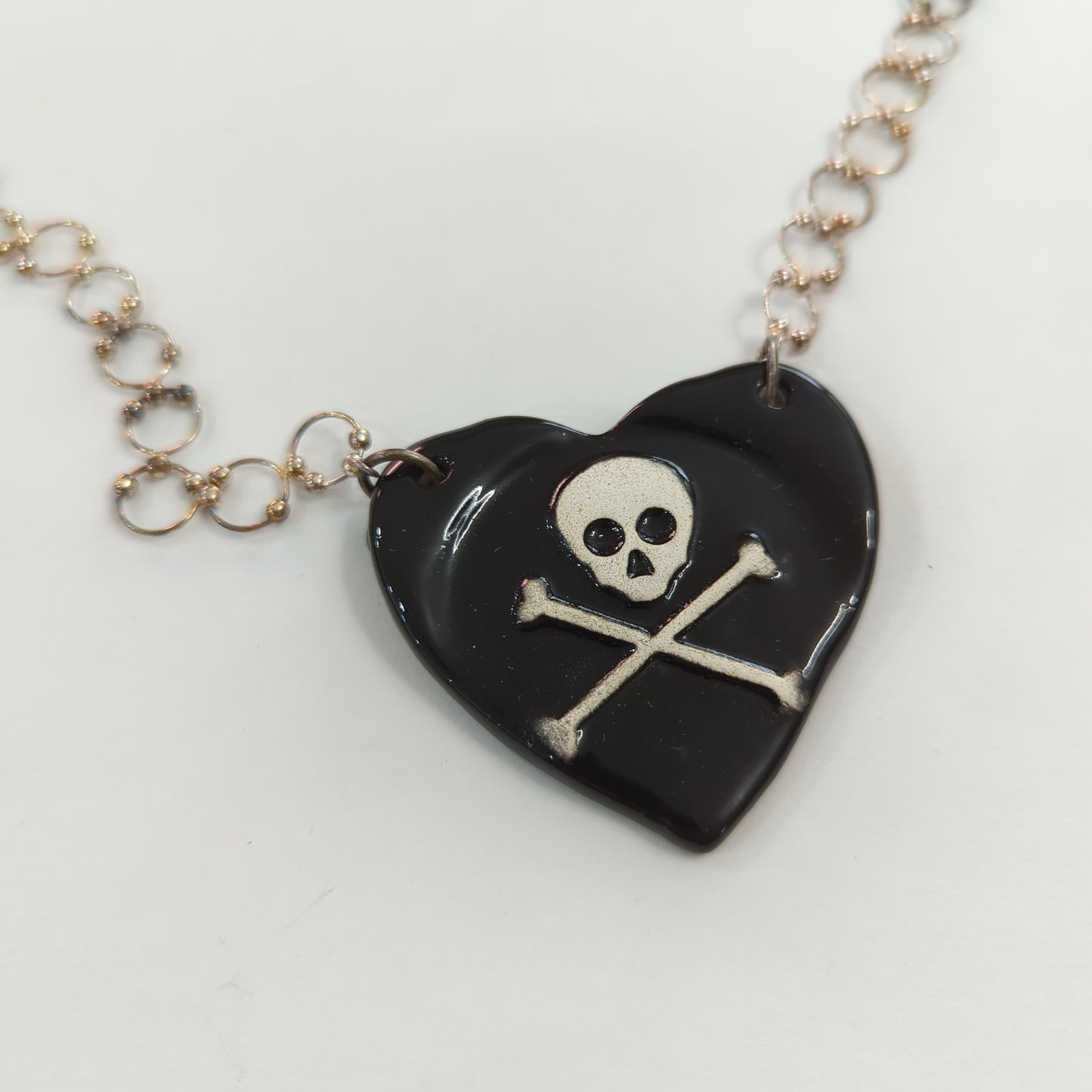 Skull and Crossbones Heart Necklace