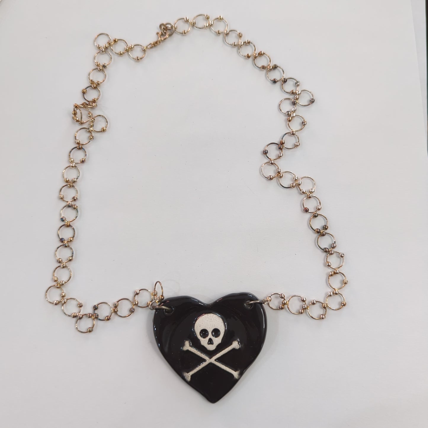 Skull and Crossbones Heart Necklace